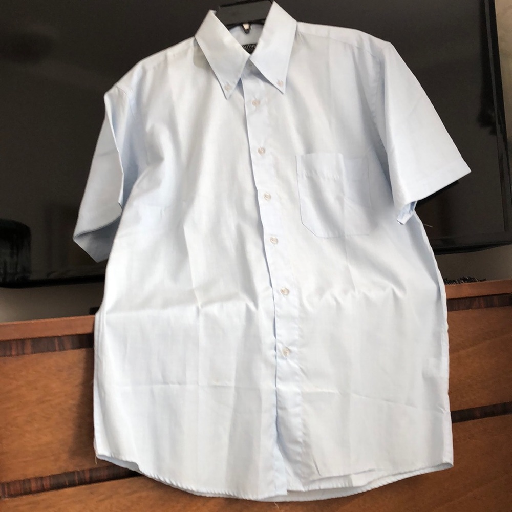Beautiful brand new men’s shirt. Color light blue. Smoke free home.